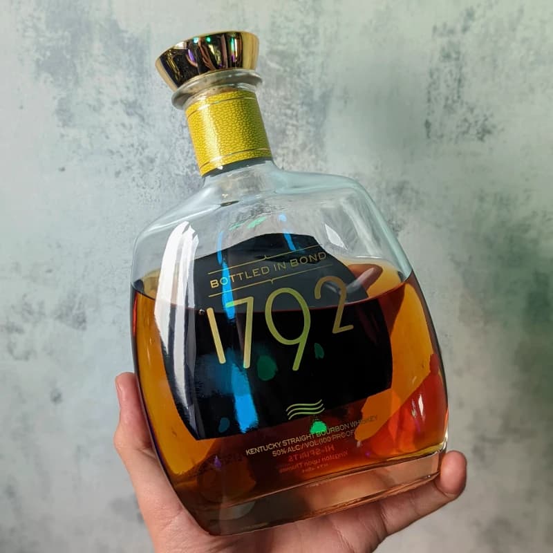 A bottle of 1792 Bottled in Bond Bourbon sitting on purple slate